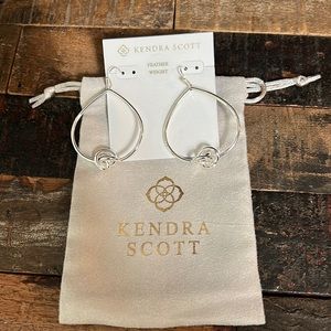 Kendra Scott silver tone Presleigh Love Knot dangle pierced earrings.